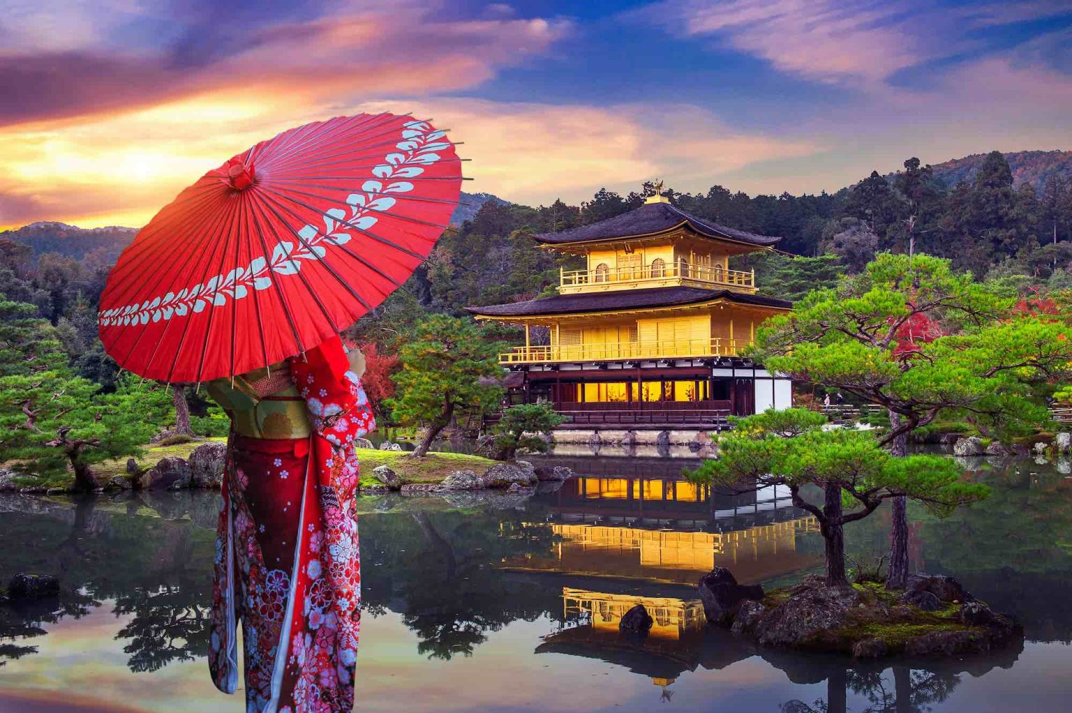 Asian woman wearing japanese traditional kimono at golden pavilion. Kinkakuji Temple in Kyoto, Japan.